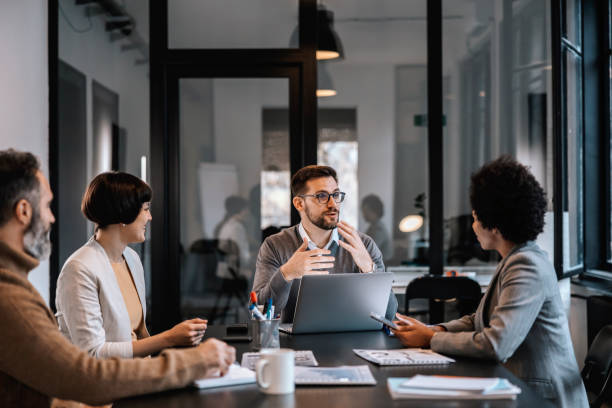 A discussion about incentives and discounts for RAK Free Zone licenses in a modern office setting.