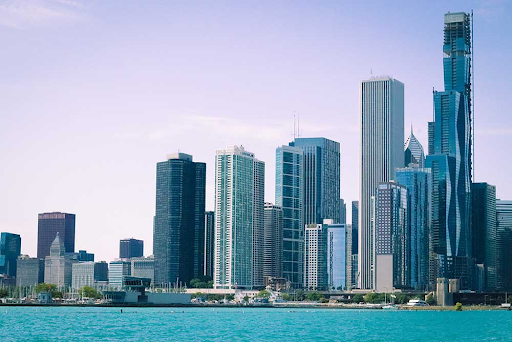 A view of a modern city skyline with tall skyscrapers against a clear sky, symbolizing business opportunities.